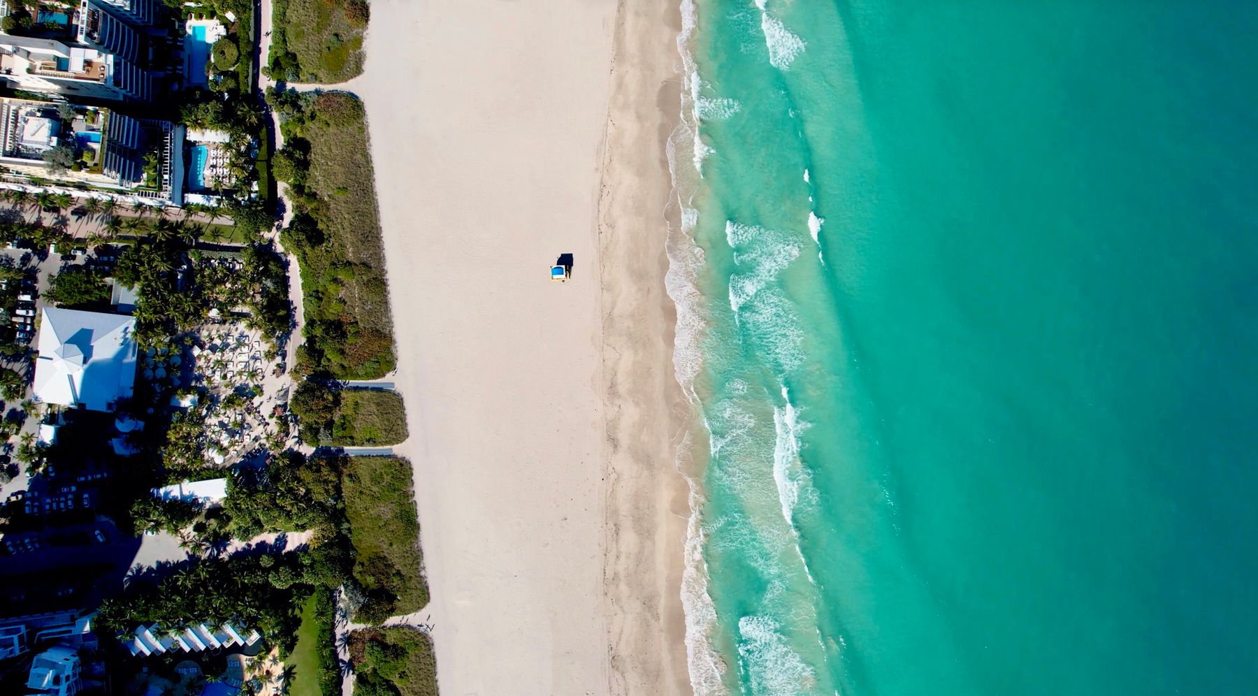 Aerial view of turquoise Atlantic water meeting the beach